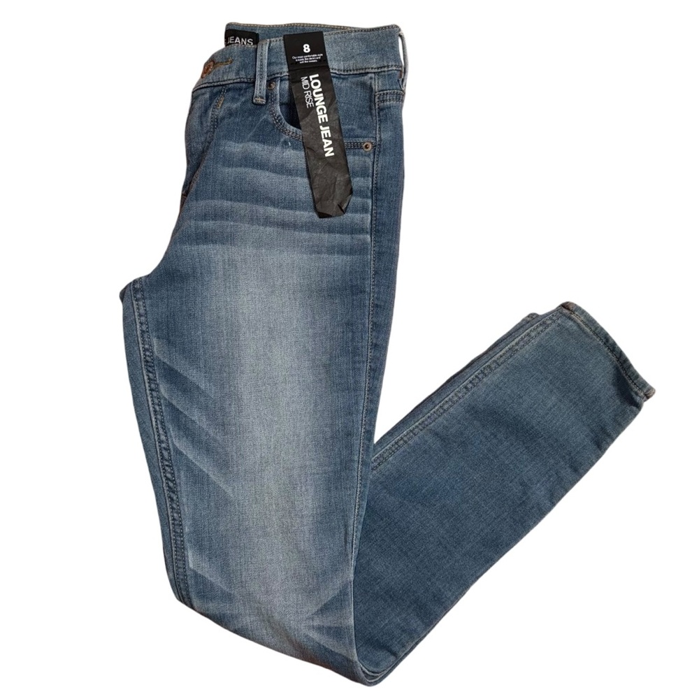 NWT Express Mid Rise Medium Wash Skinny Jeans.